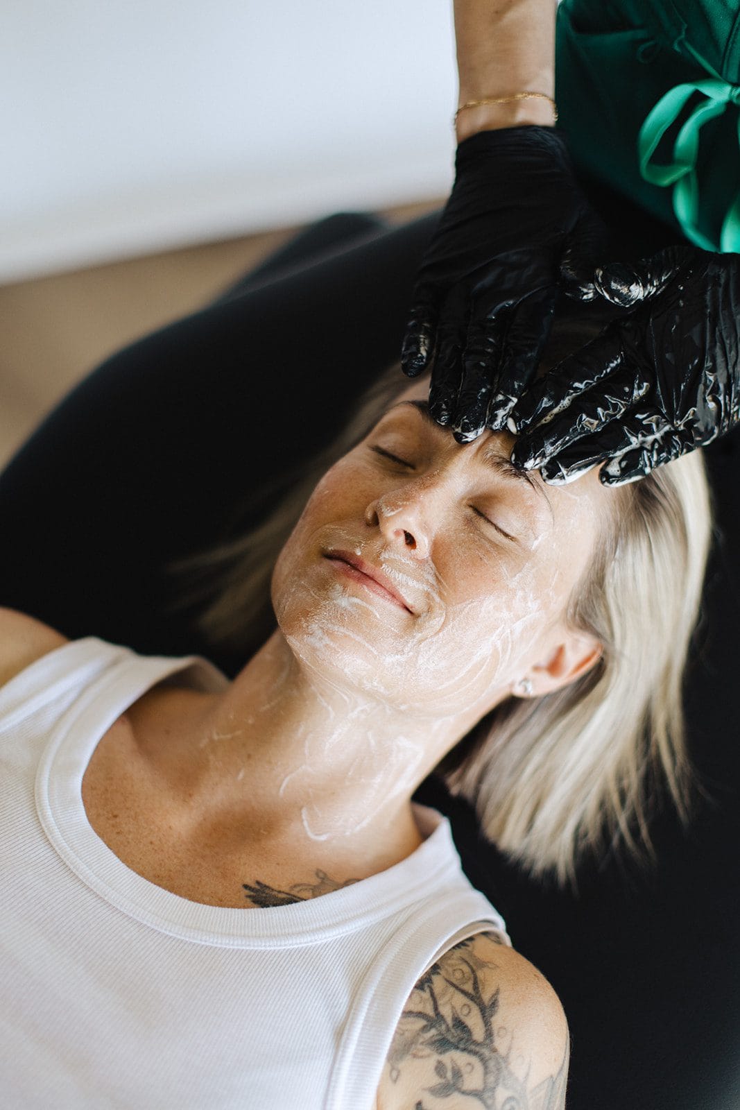Patient receiving relaxing skincare treatment at Onyx Beauty Lab.