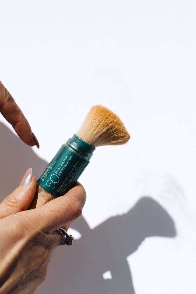 ONYX Beauty Lab | The Onyx Beauty Lab 2025 Holiday Gift Guide Colorescience Brush-On SPF 50 held in hand.